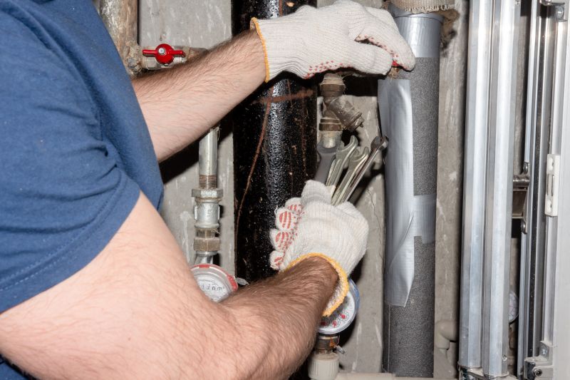 Plumber Repairing Pipe